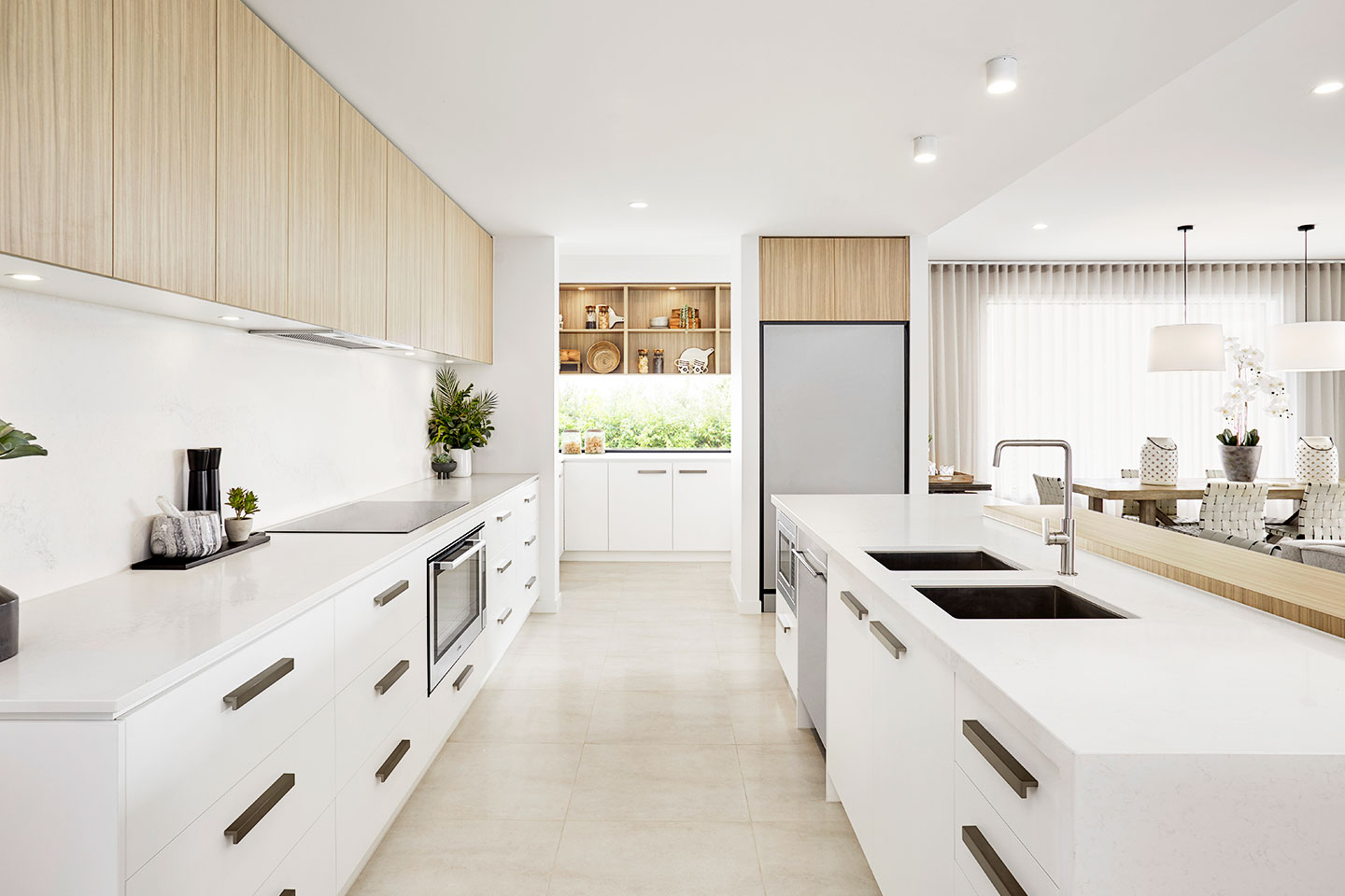 Modern kitchen view in a single-family home in Dubai, featuring sleek cabinetry, premium appliances, and a spacious layout.