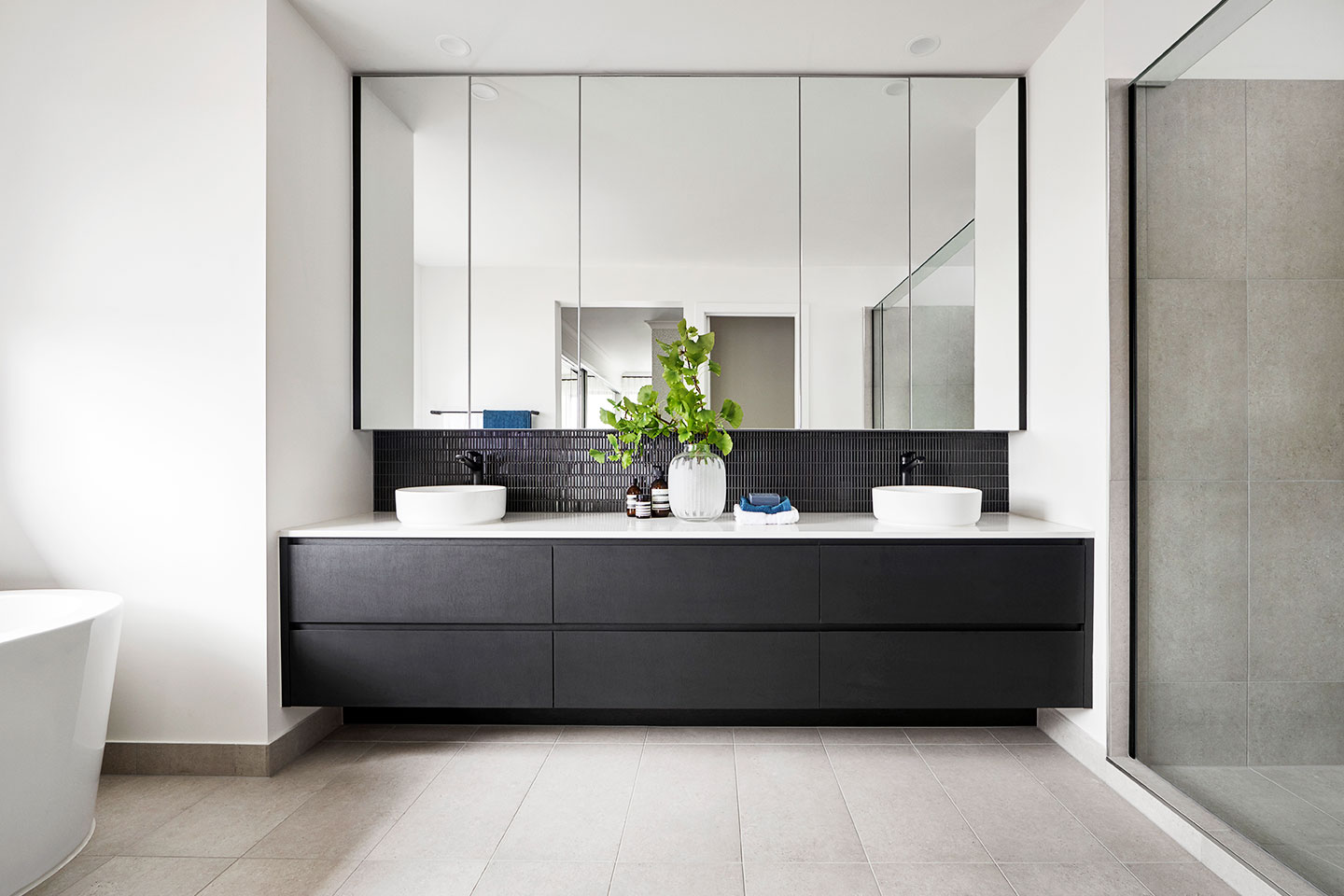 Elegant bathroom interior in a Dubai luxury property, featuring modern fixtures, ambient lighting, and premium finishes.