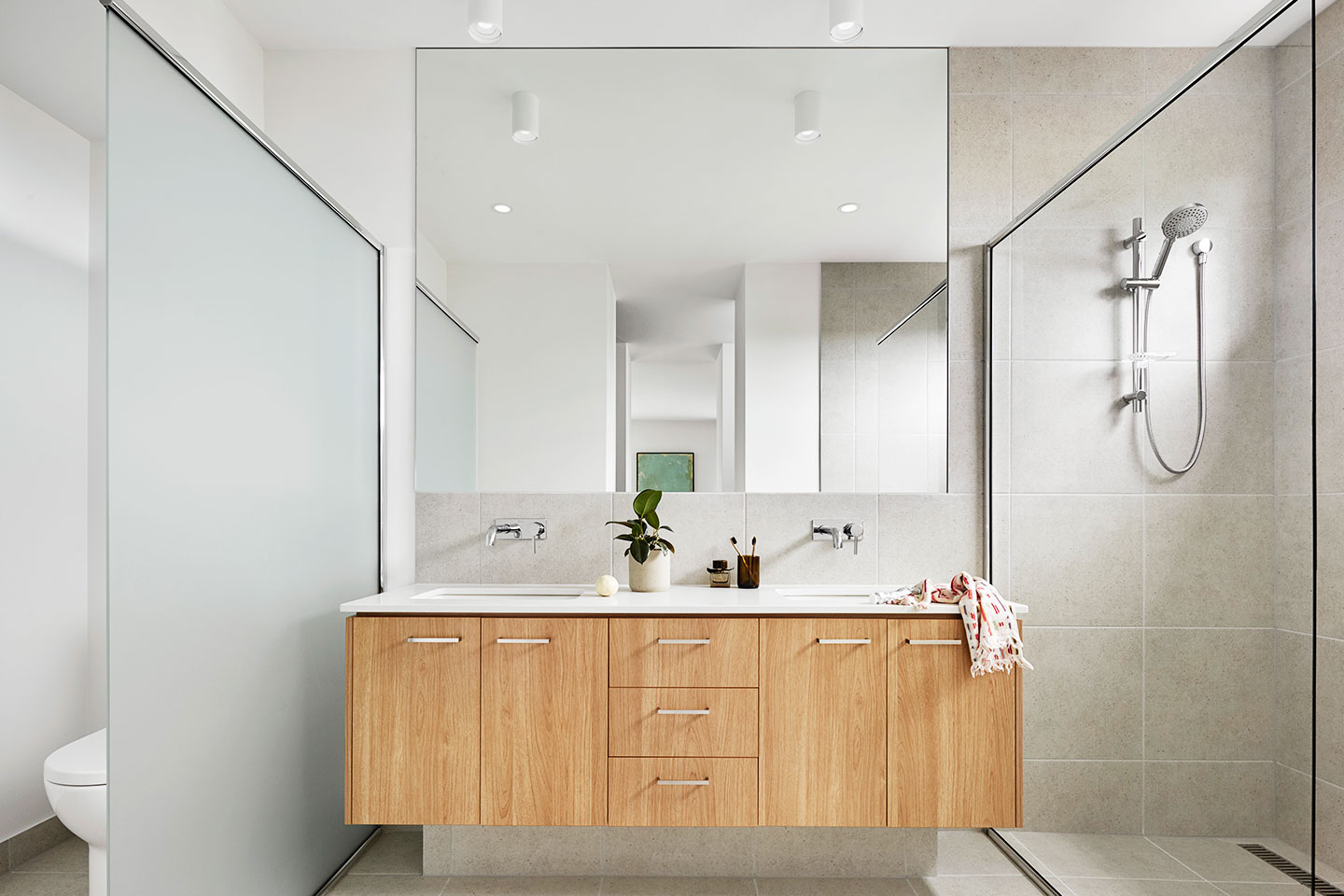 Modern bathroom interior with elegant fixtures and clean design, representing luxury real estate finishes.