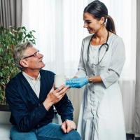 photo-happy-female-doctor-giving-water-her-patient-nursing-home-assistant-help-those-who-need-it