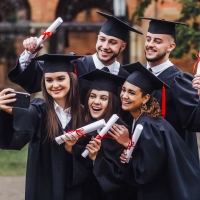 portrait-multiracial-graduates-holding-diploma-doing-selfie-phone-lifestule